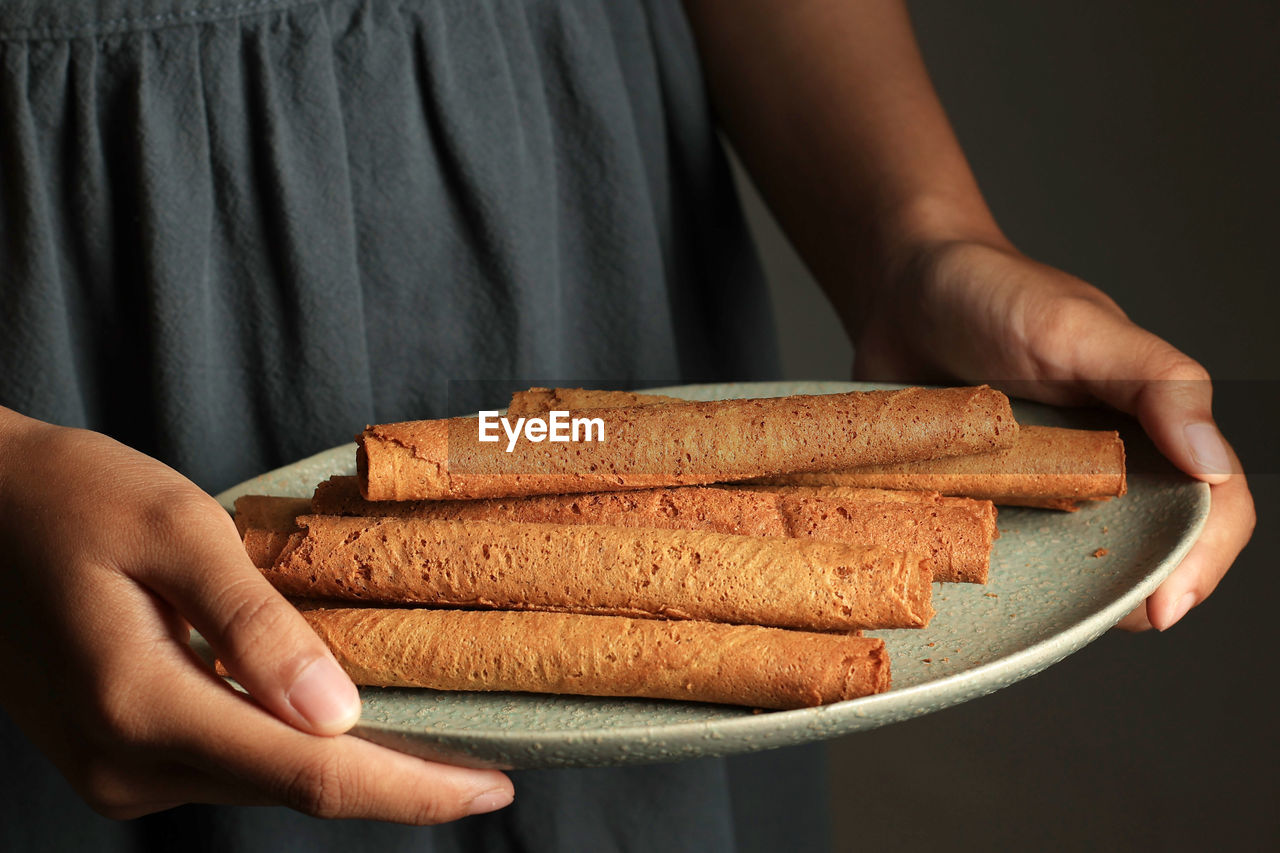 midsection of person holding food