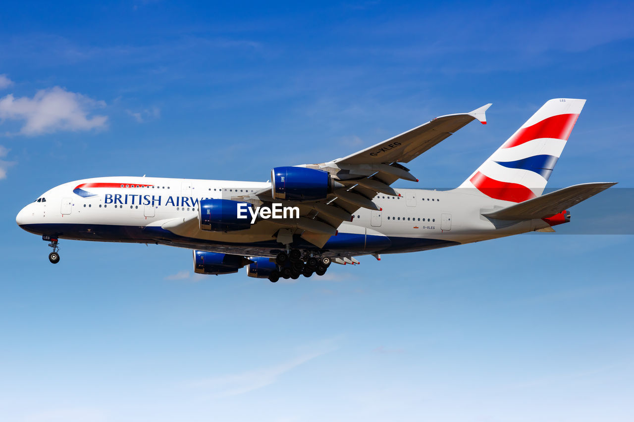 LOW ANGLE VIEW OF AIRPLANE AGAINST SKY