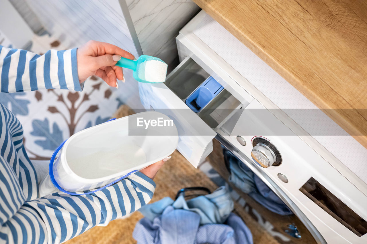 high angle view of person cleaning equipment