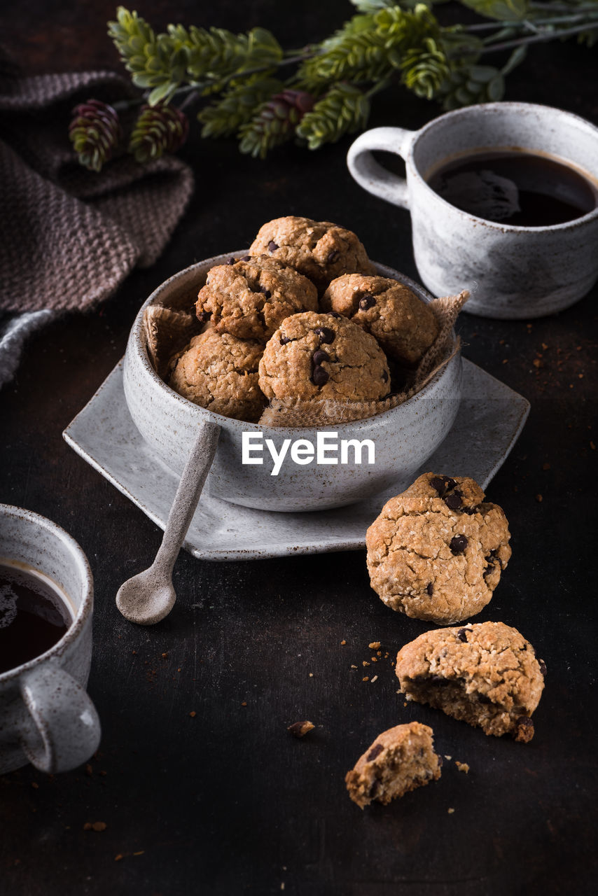 High angle view of cookies and coffee on table