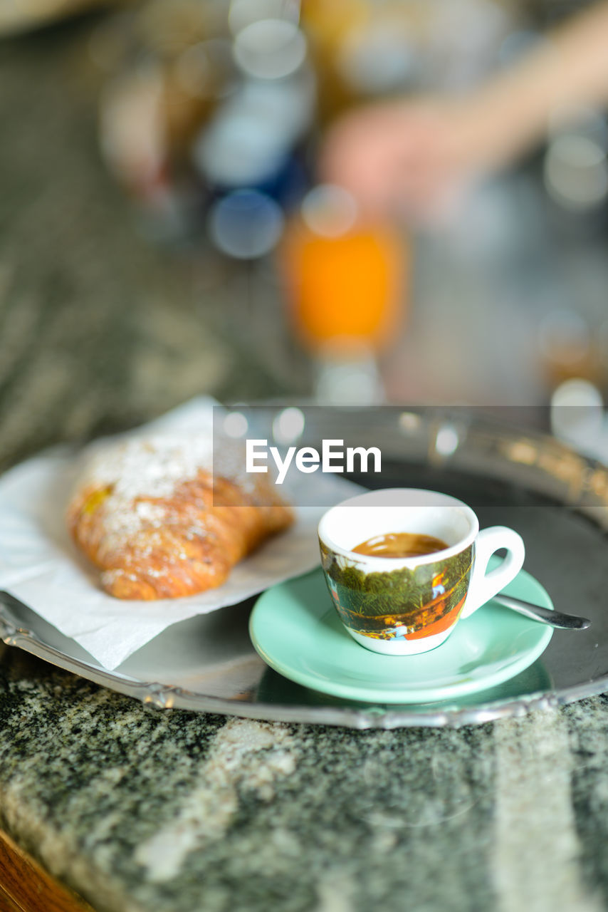 Espresso coffee and custard pastry cream croissant for a caloric