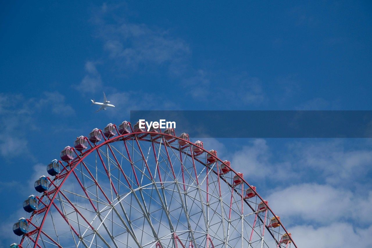 low angle view of ferris wheel