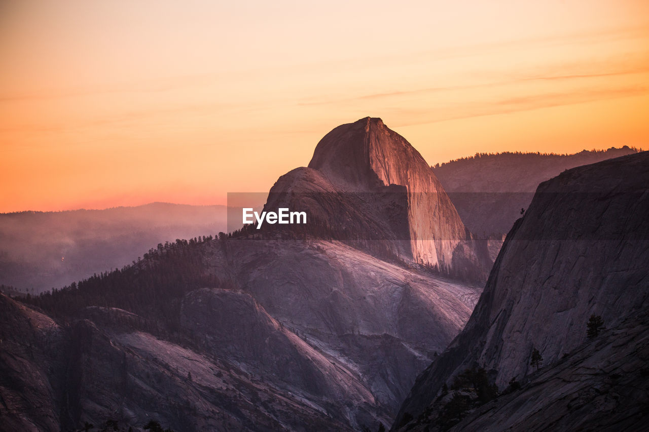 Scenic view of rock formation against sky during sunset