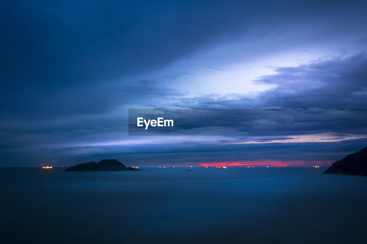 Scenic view of sea against sky at sunset