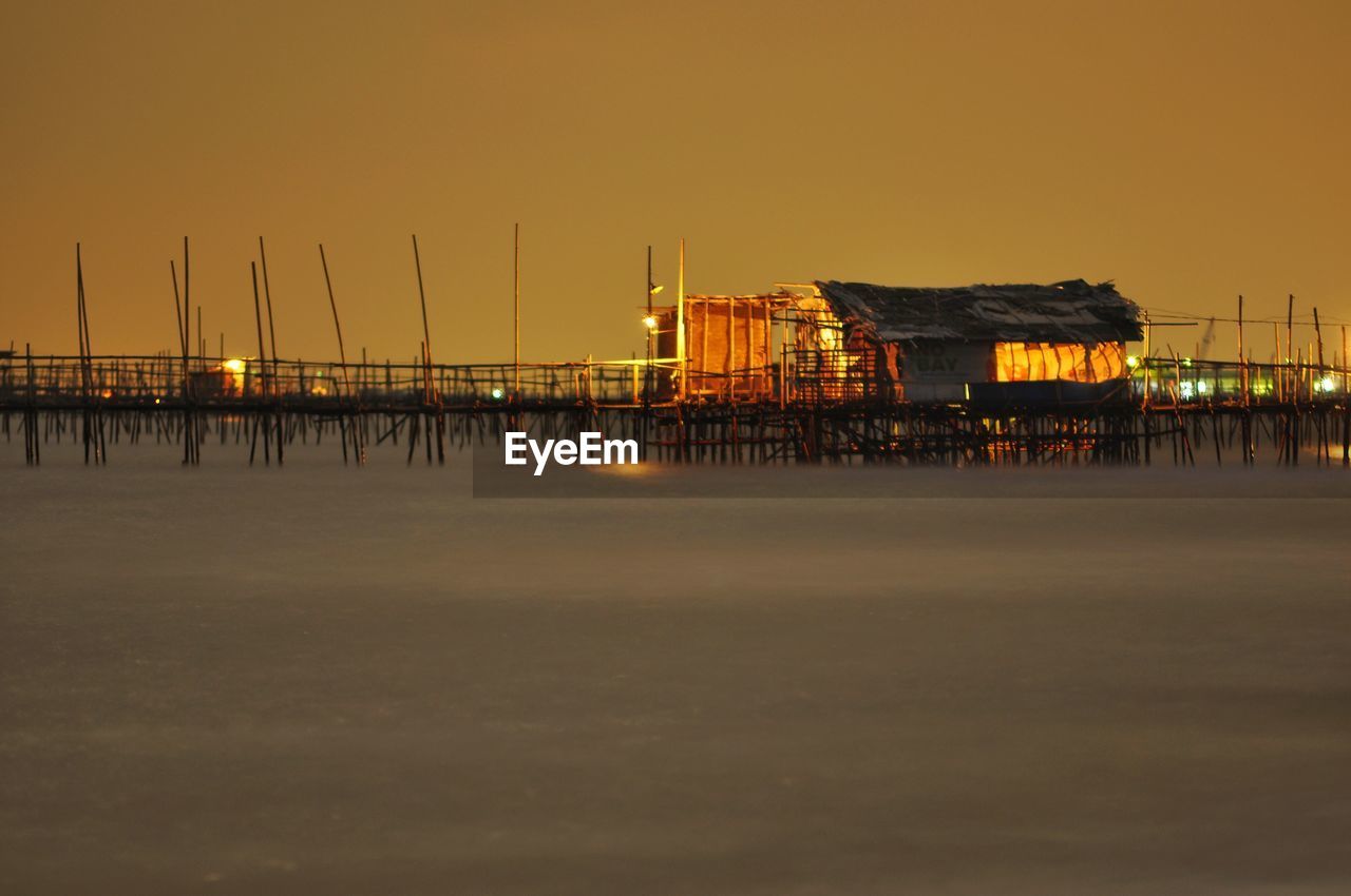 Pier over sea at night