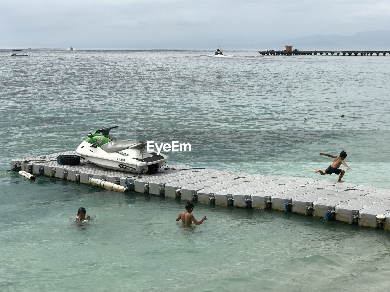 PEOPLE SWIMMING IN SEA