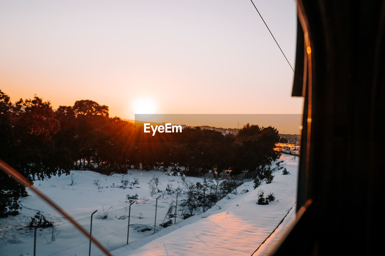 Landscape of traveling by train in a snowy day in the sunset. travel  snow photo concept