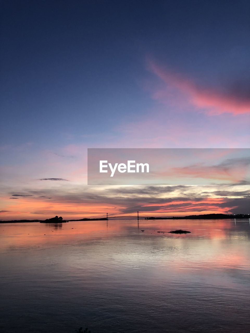 scenic view of sea at sunset