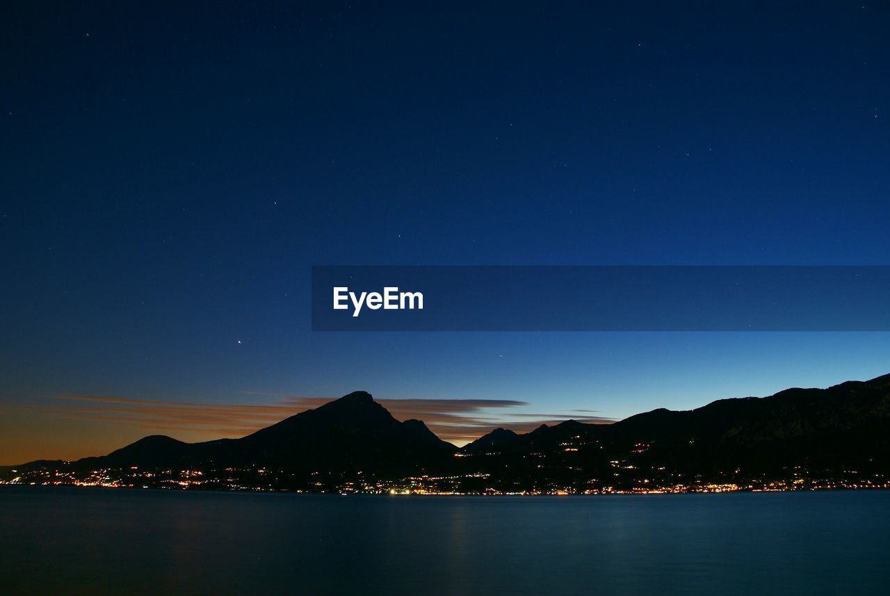 Scenic view of sea against sky at night