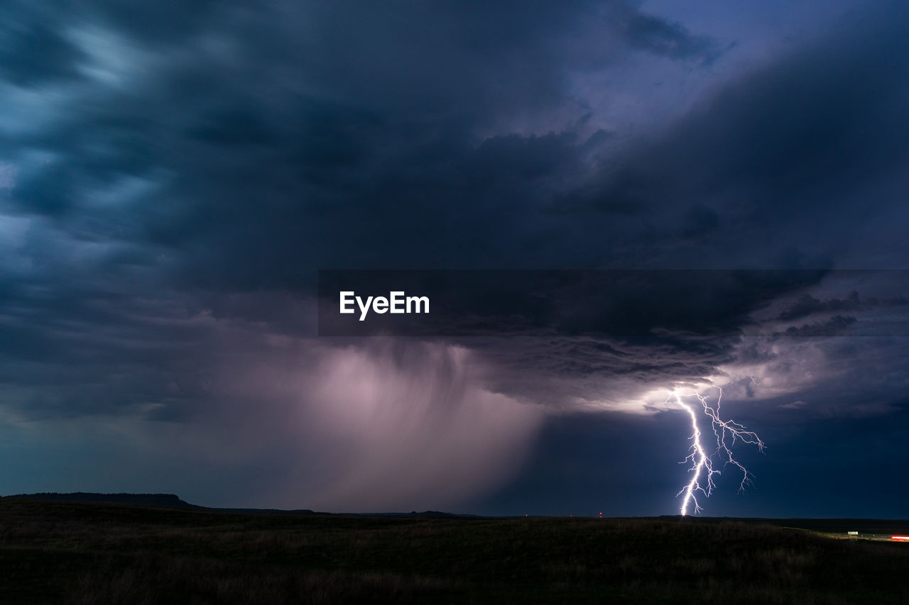 Lightning strikes from a distant thunderstorm near buffalo, south dakota.