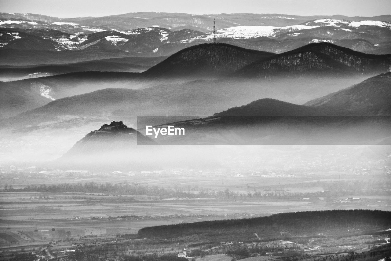 Scenic view of snowcapped mountains against sky