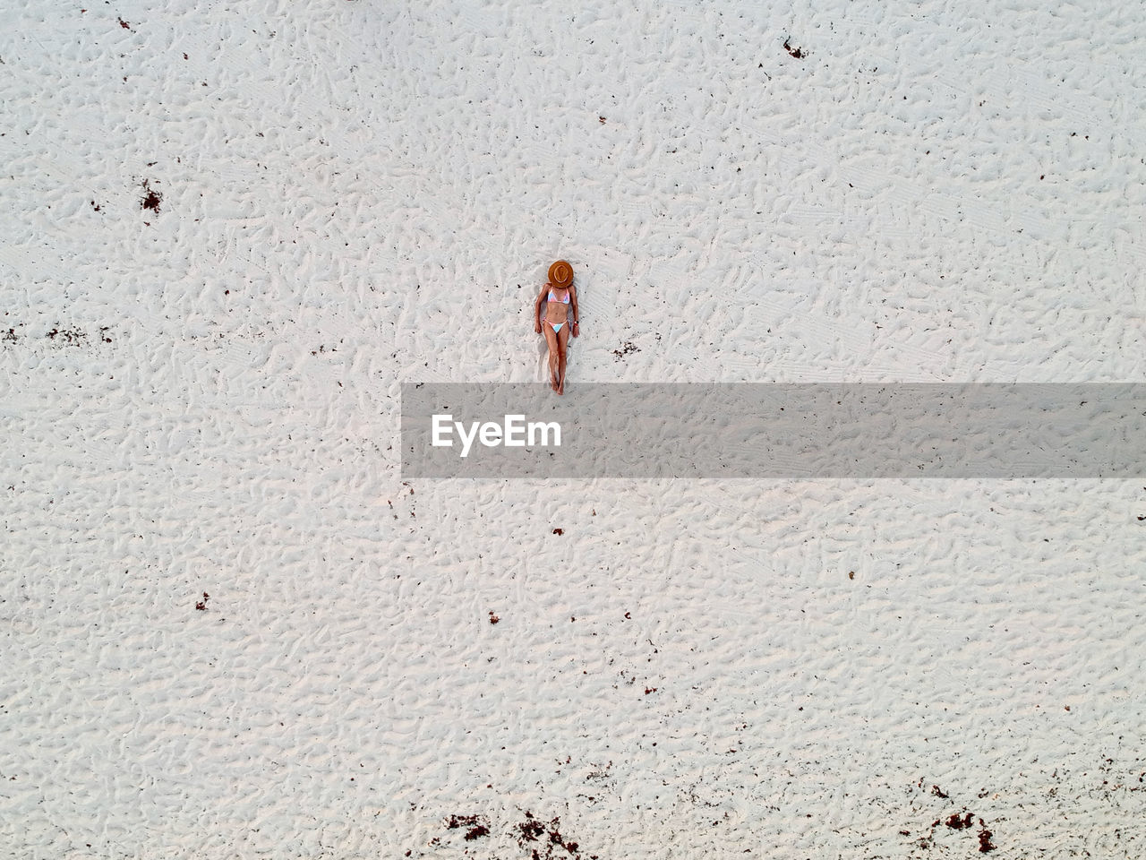 Aerial view of young woman on caribbean beach