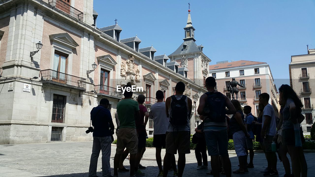 TOURISTS ON SIDEWALK