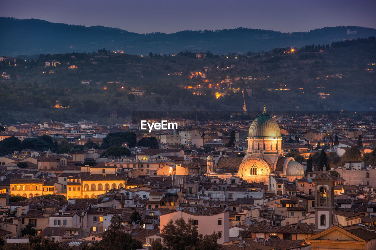 High angle view of illuminated buildings in city