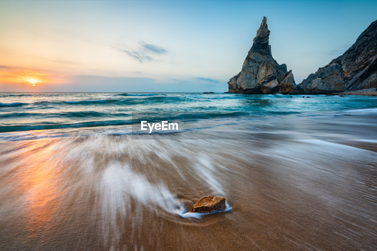 Scenic view of sea against sky at sunset