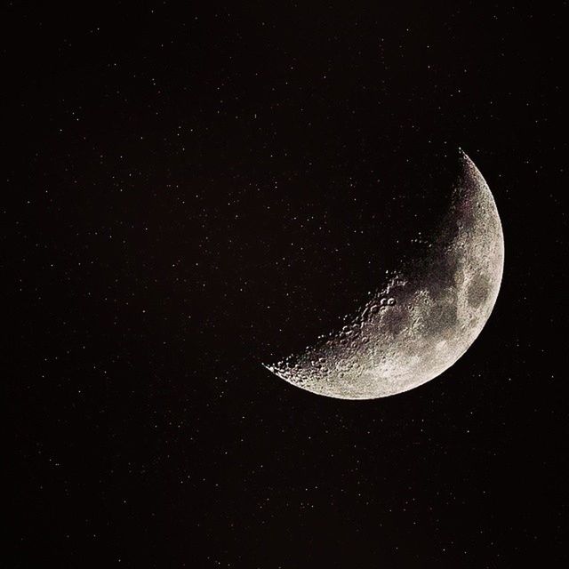 LOW ANGLE VIEW OF MOON IN SKY AT NIGHT