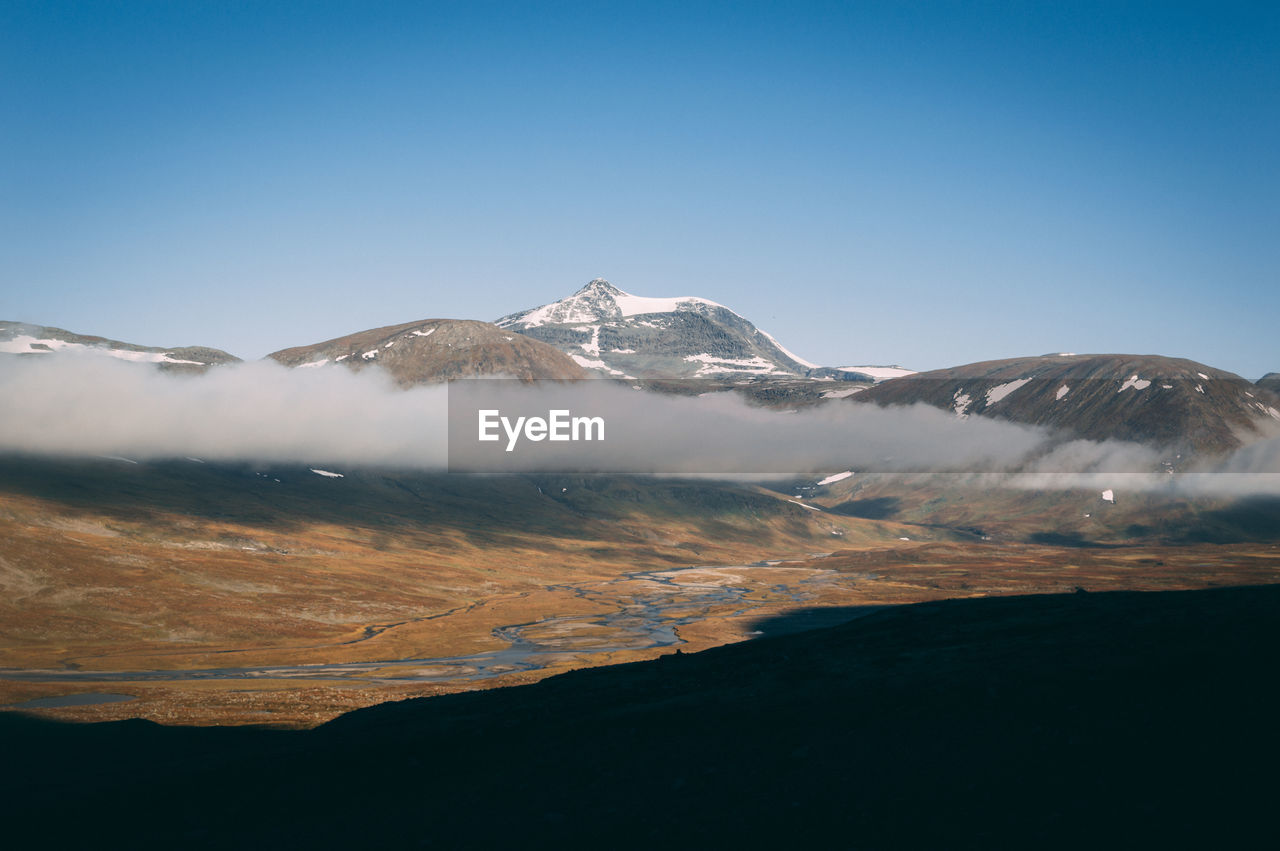 Scenic view of mountains against clear sky