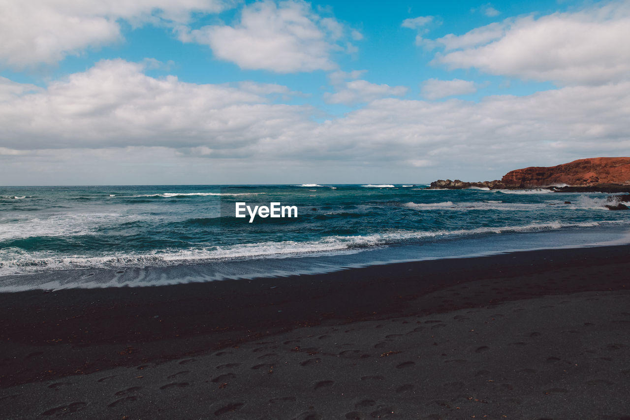 Scenic view of beach against sky