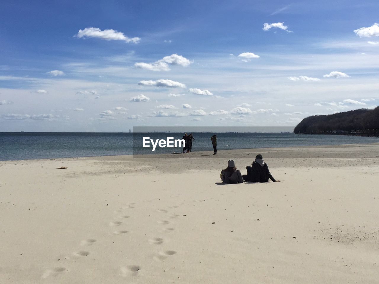 People on sandy beach