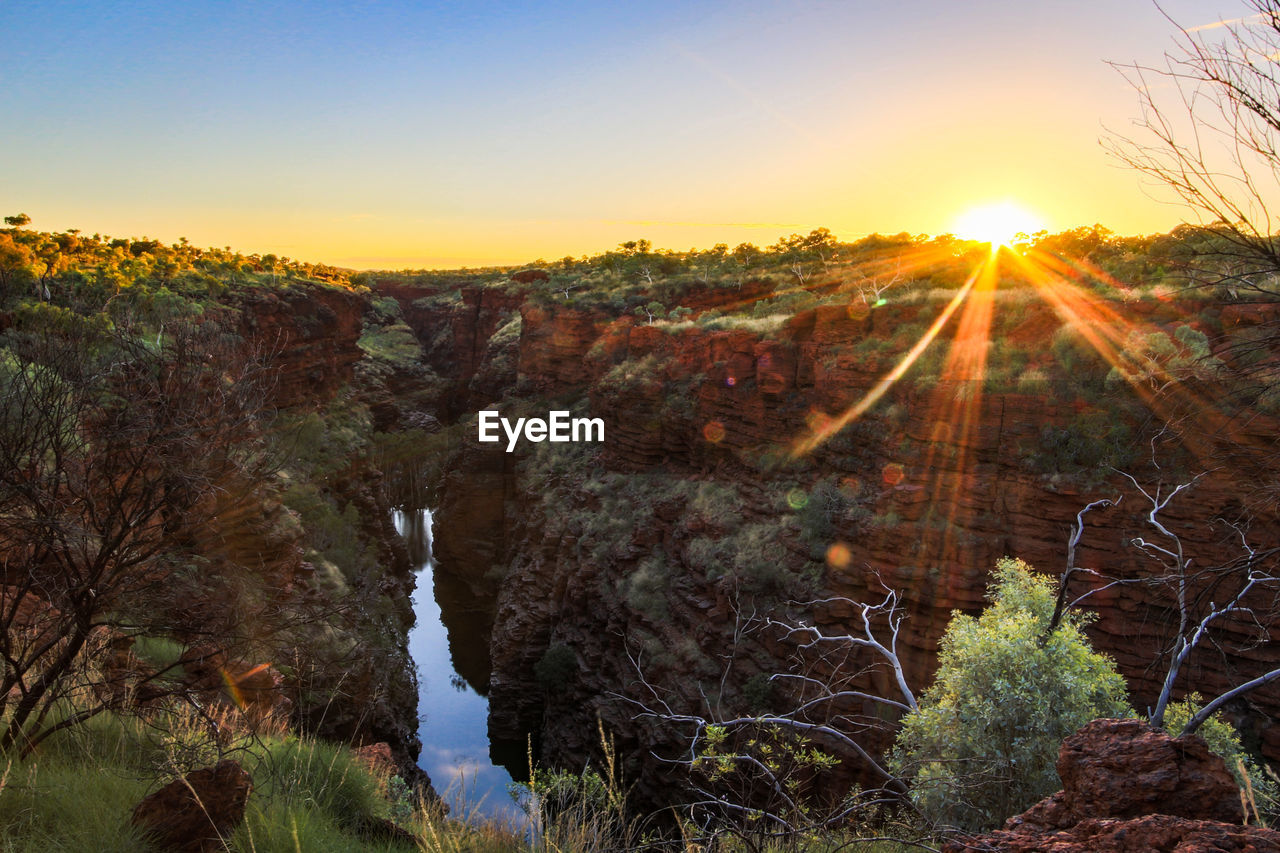 Scenic view of landscape against sky during sunset