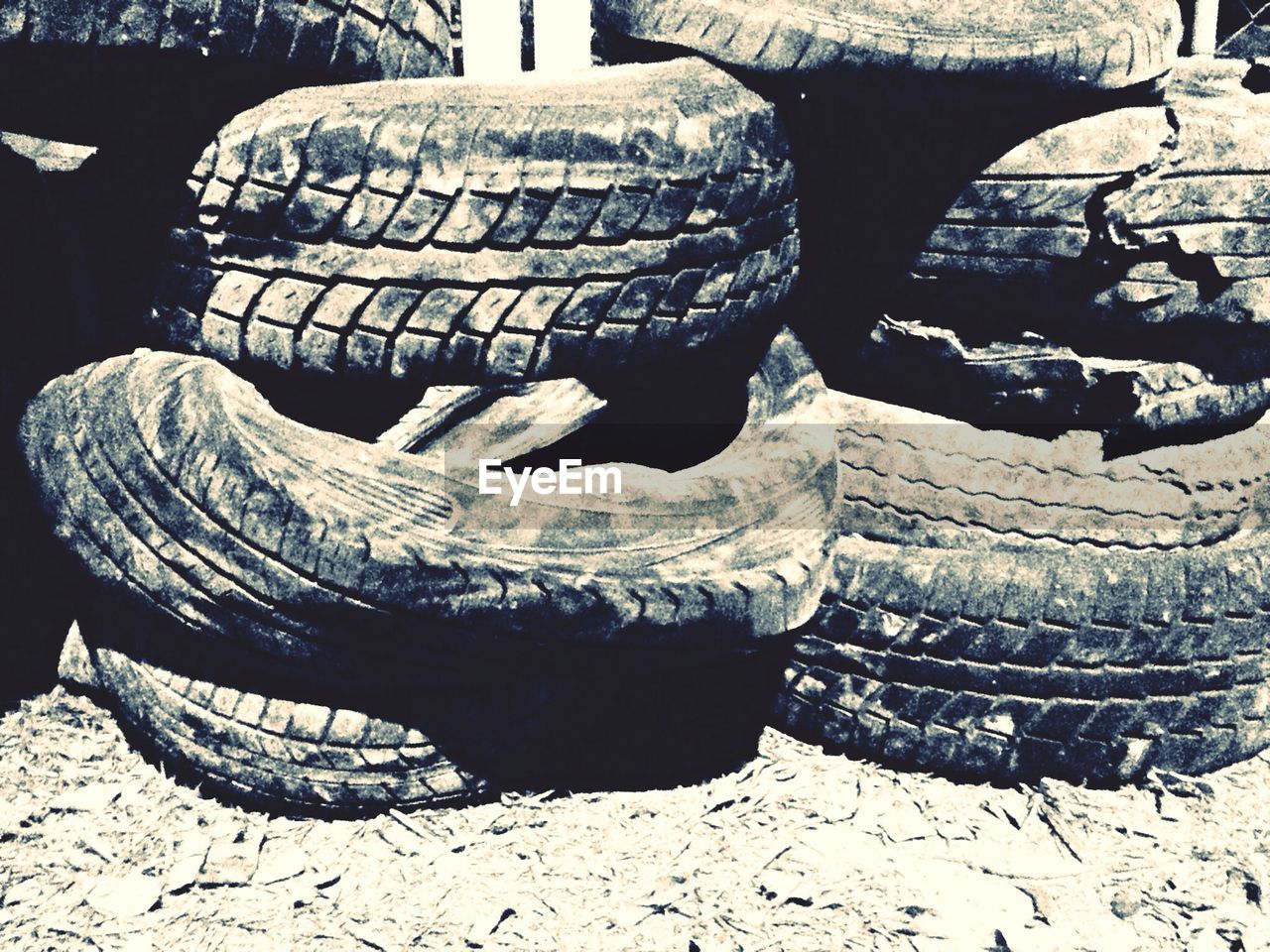 Stack of old tires in dust
