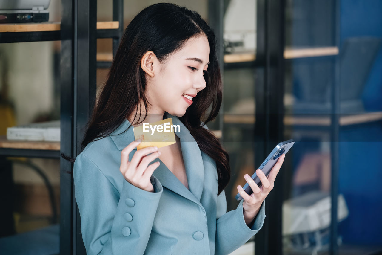 young businesswoman using mobile phone