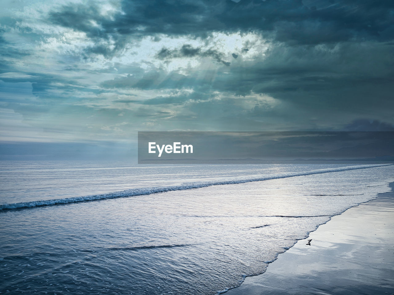 Scenic view of sea against sky during winter