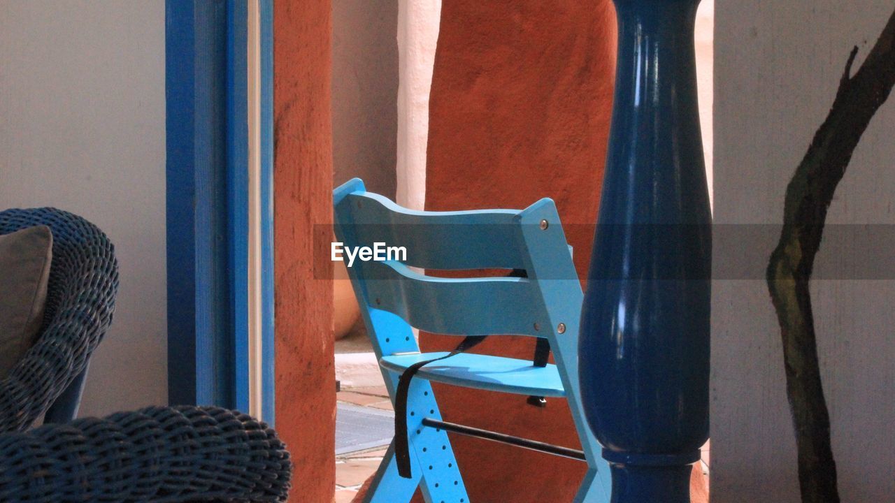 Blue chair at doorway