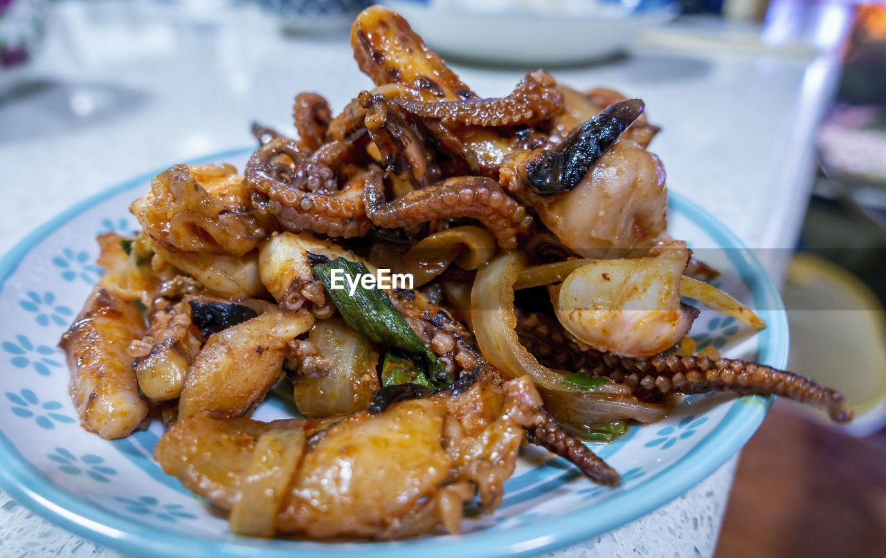 High angle view of cooked squid in plate on table