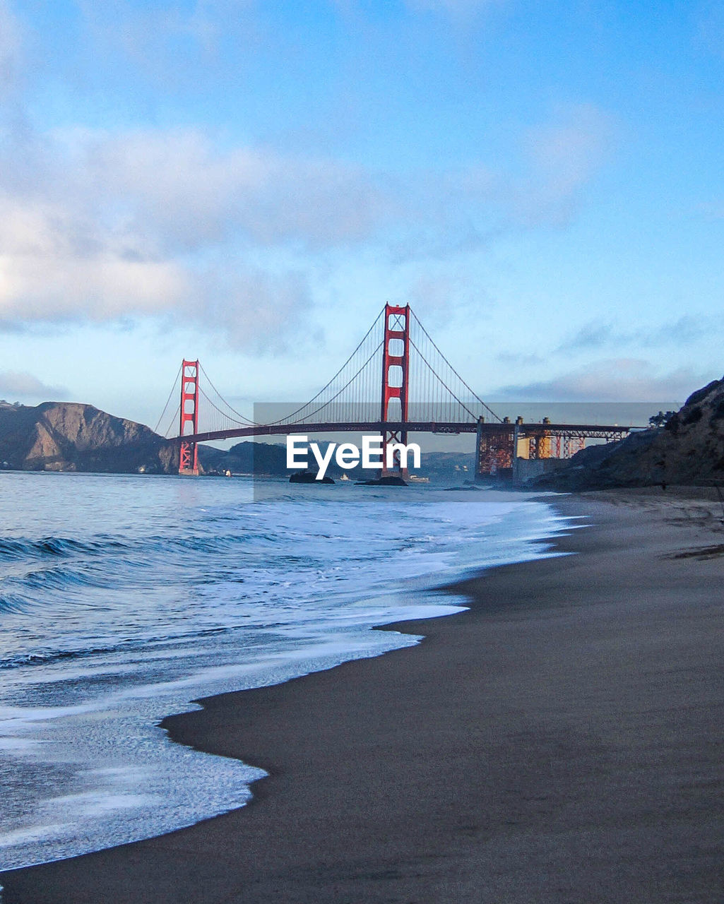 Golden gate bridge over sea against sky