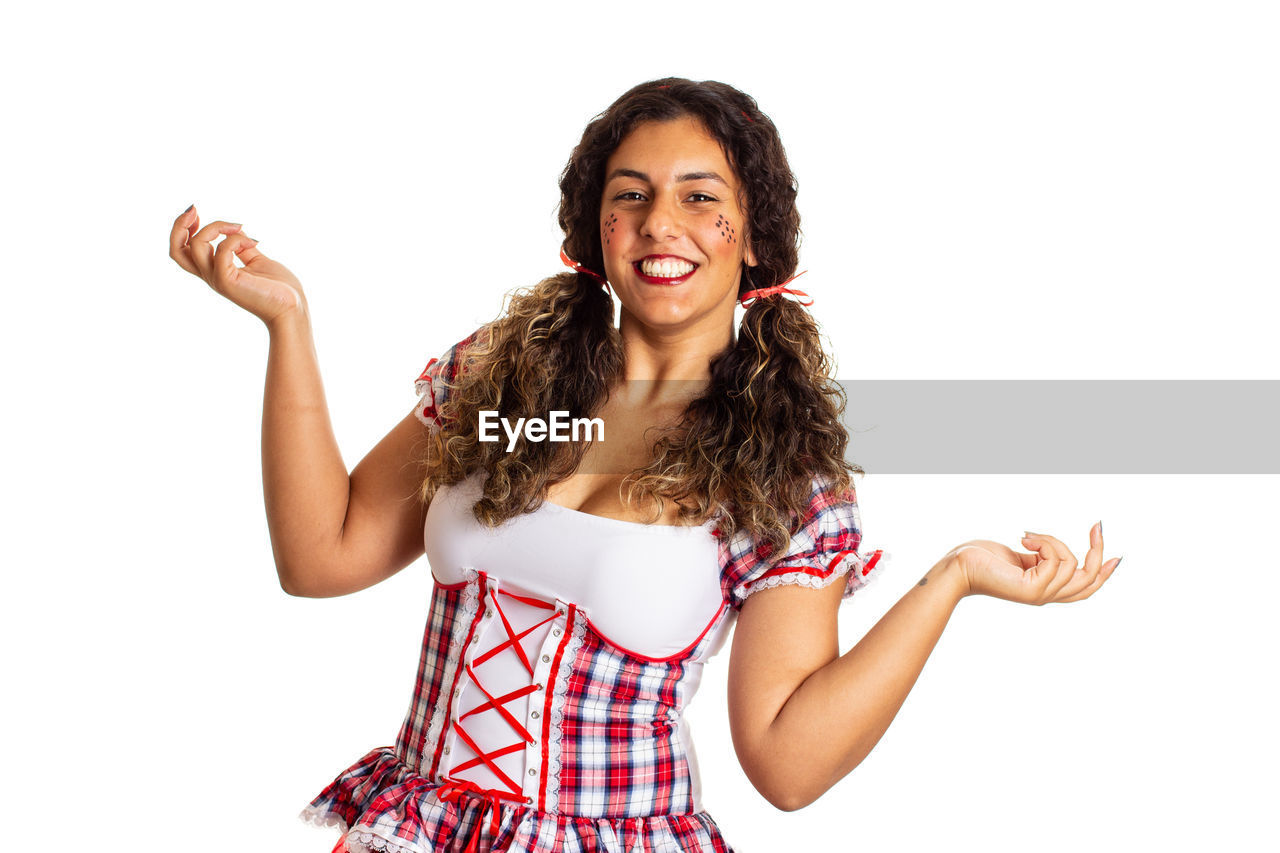 white background, happiness, smiling, emotion, women, one person, studio shot, portrait, cheerful, cut out, positive emotion, adult, young adult, looking at camera, hairstyle, limb, indoors, human limb, arm, joy, excitement, fun, teeth, long hair, smile, female, gesturing, finger, curly hair, laughing, casual clothing, enjoyment, waist up, fashion, carefree, ecstatic, lifestyles, copy space, clothing, brown hair, front view, person, vitality, relaxation, arms raised, cute, photo shoot, standing, teenager, facial expression, child, hand raised, hand, arms outstretched, shouting, human mouth, communication, mouth open, arts culture and entertainment