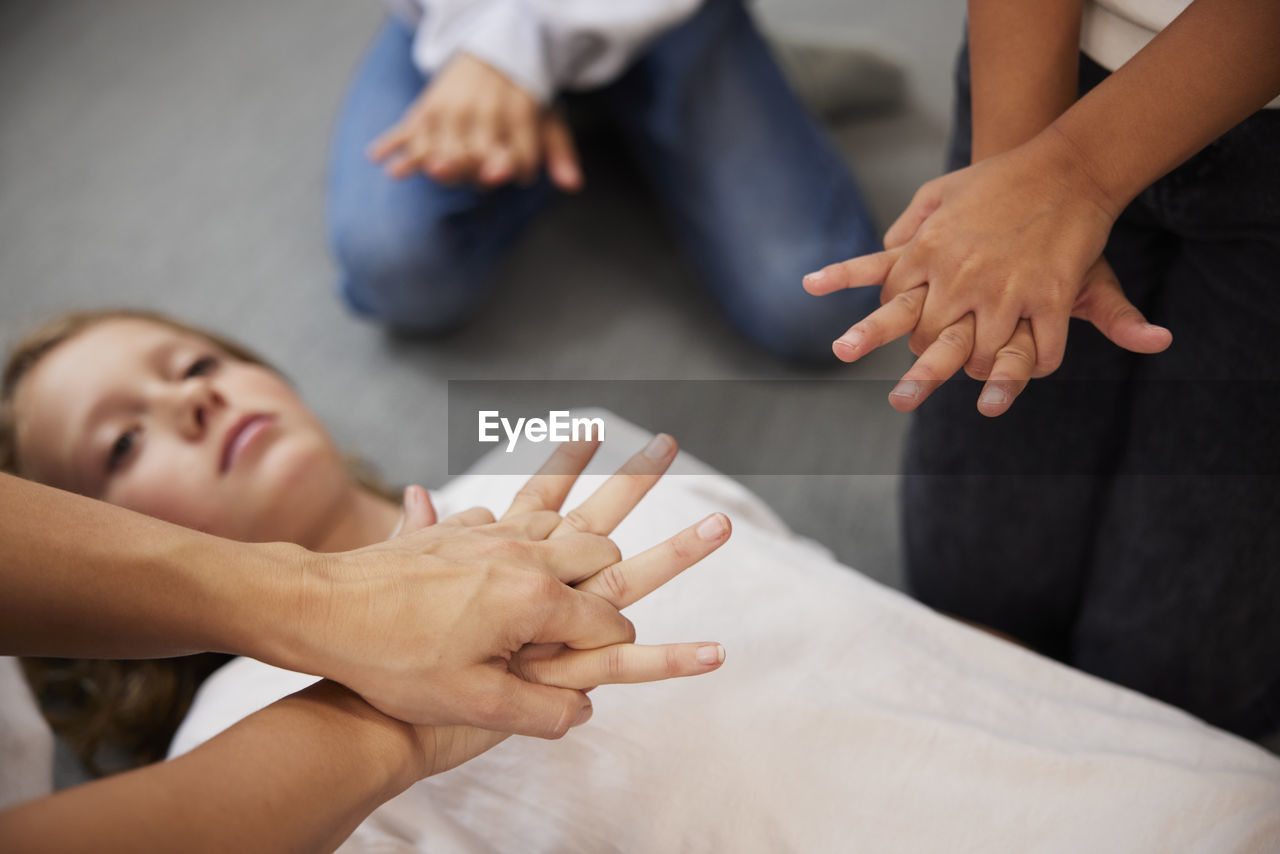 Teacher giving first aid training