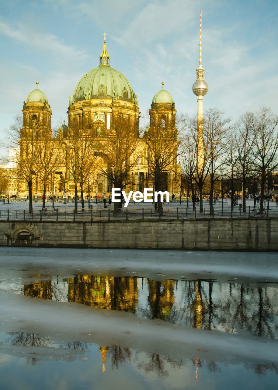 Berlin cathedral and fernsehturm in front of frozen river