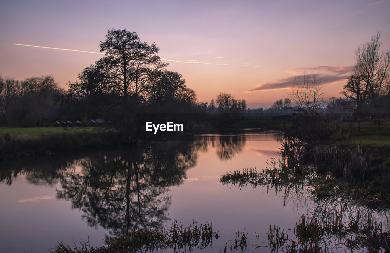 A winter sunset over the river stour in dedham in essex, uk