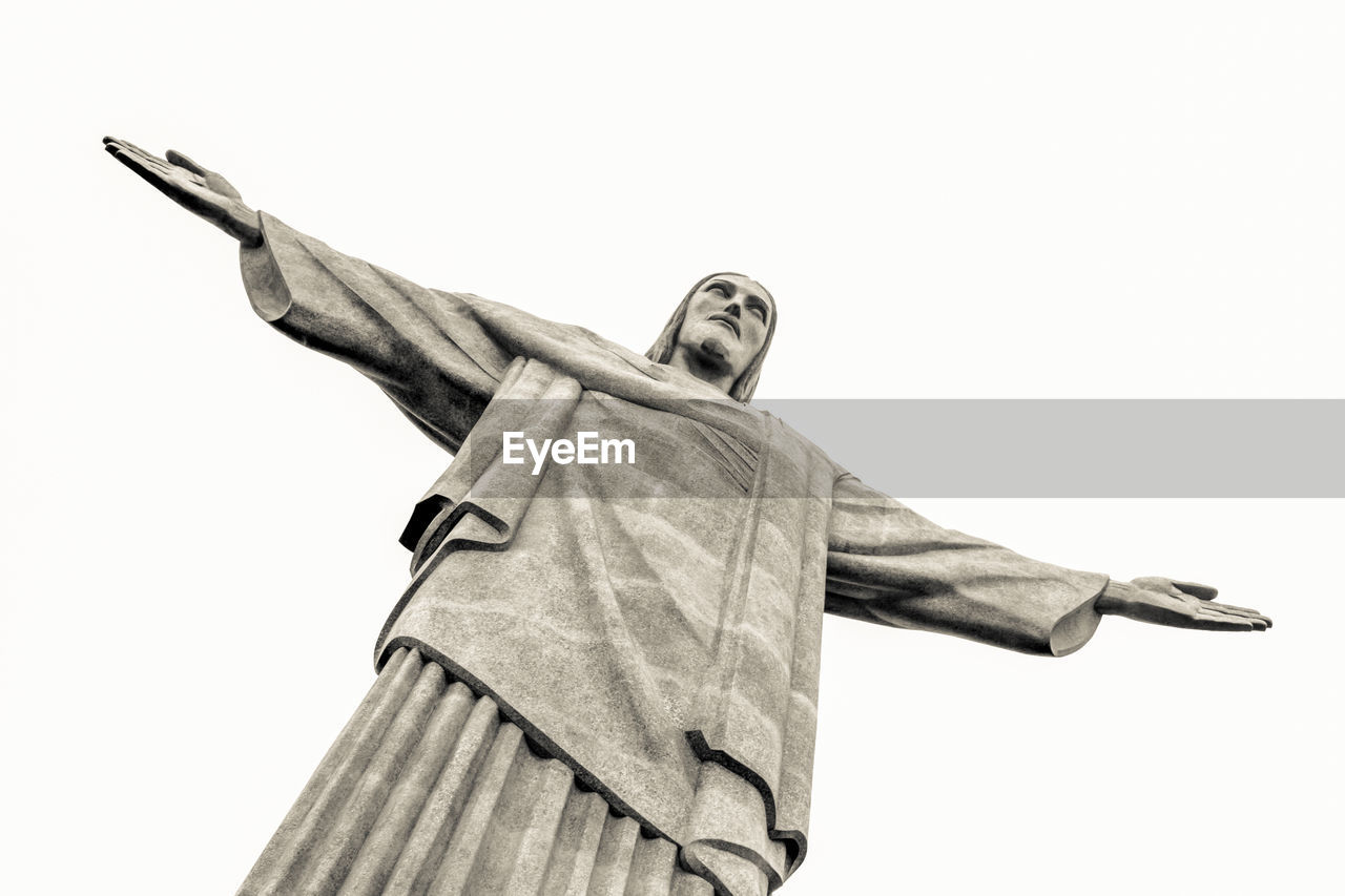 low angle view of jesus christ against clear sky