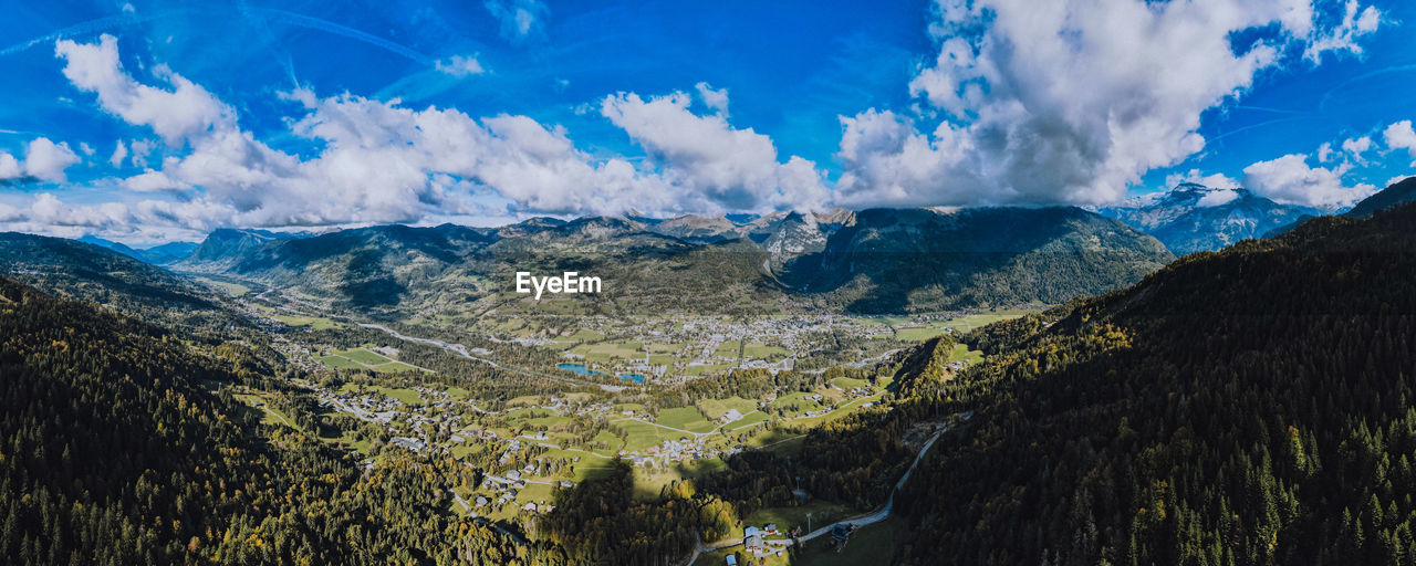 PANORAMIC VIEW OF LANDSCAPE AND MOUNTAINS AGAINST SKY