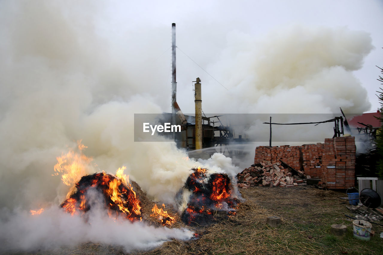 SMOKE STACK AGAINST SKY