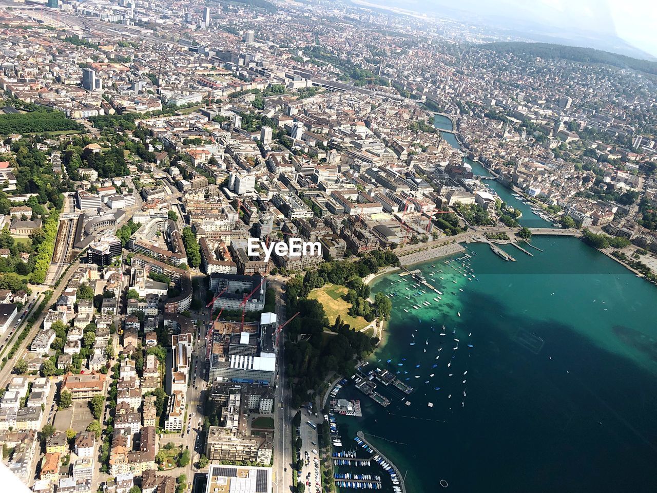 High angle view of city by river