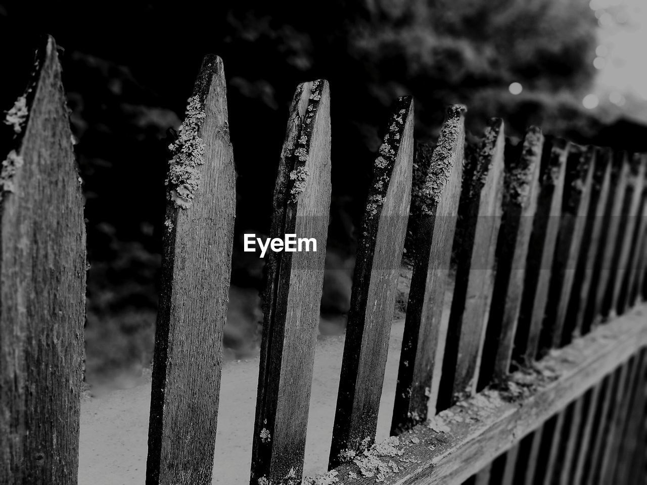 CLOSE-UP OF METALLIC FENCE ON RAILING