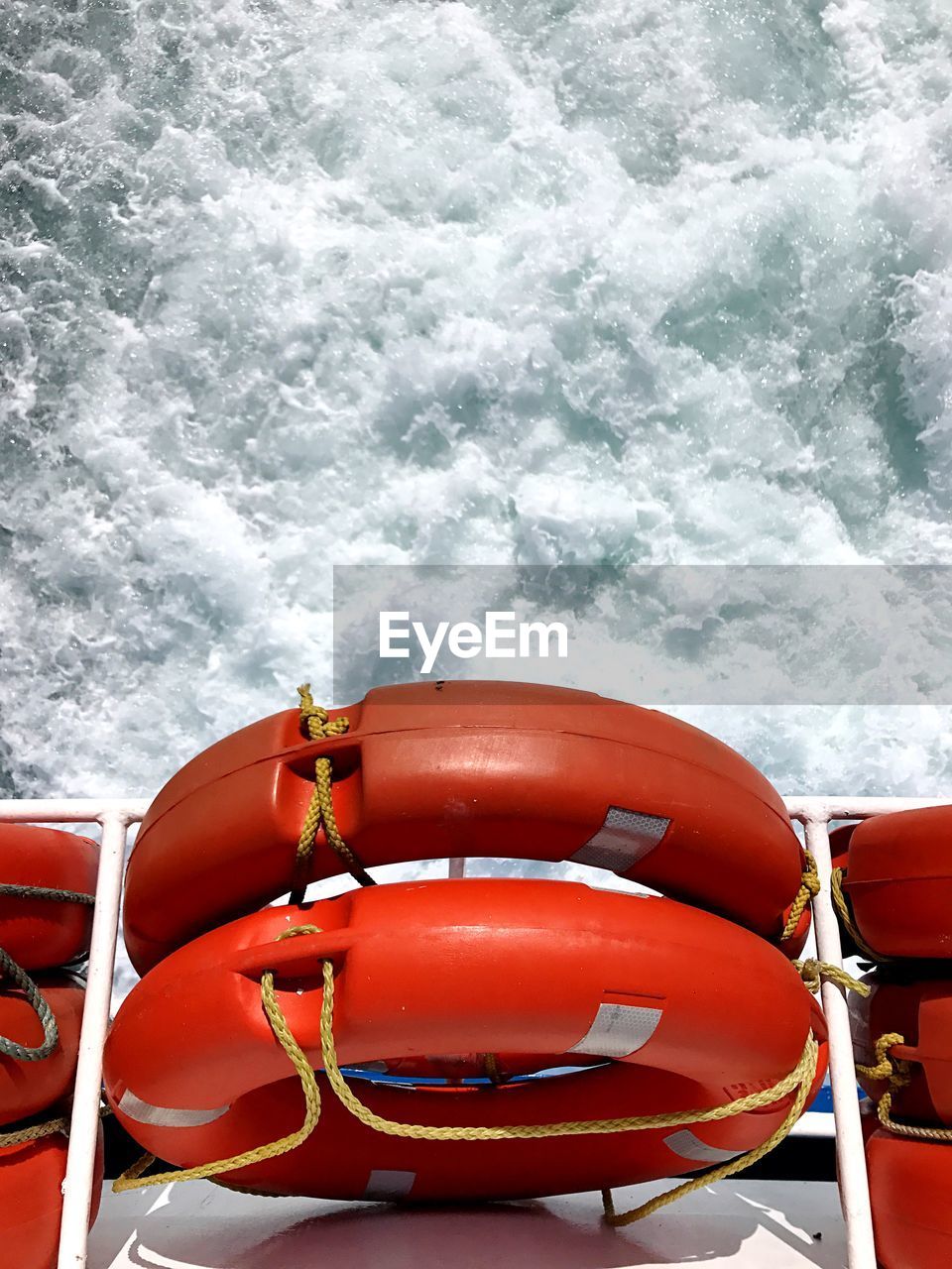 Red life saver looking at sea