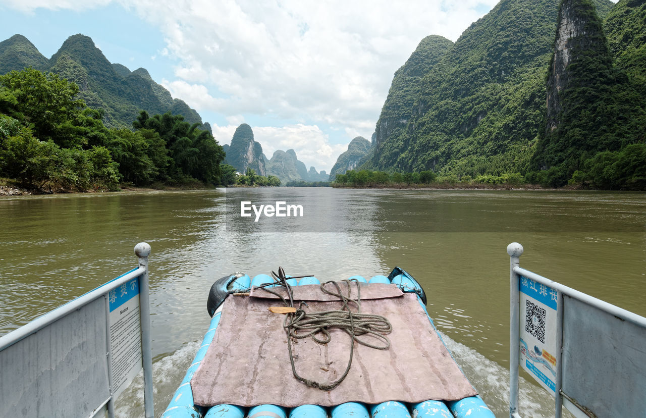 PANORAMIC VIEW OF LAKE AGAINST MOUNTAIN RANGE