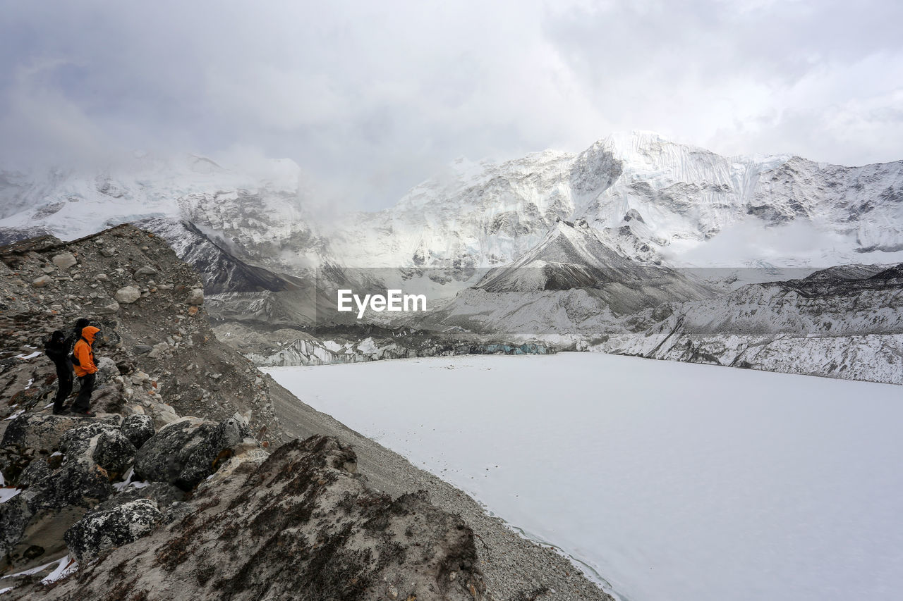 Idyllic view of snow covered landscape and mountains