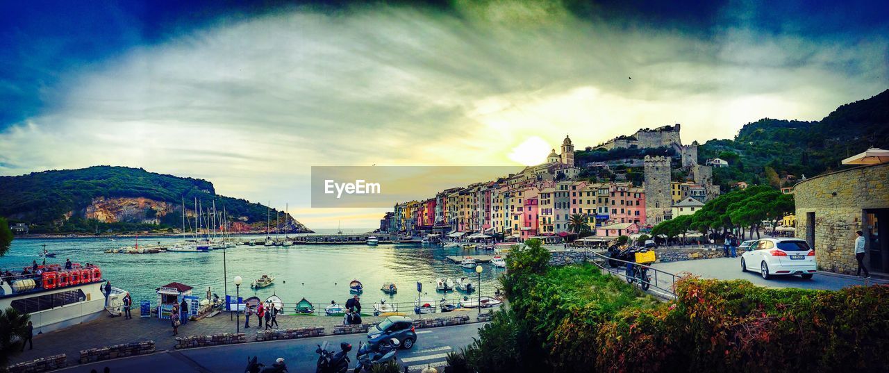 Panoramic shot of river by buildings against sky at porto venere