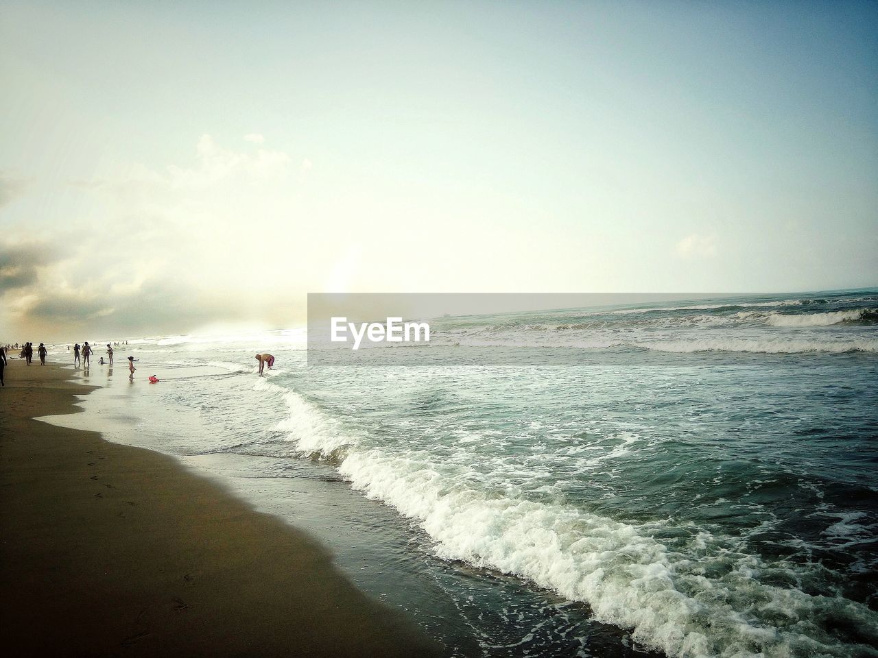 SCENIC VIEW OF BEACH AGAINST SKY DURING SUNRISE