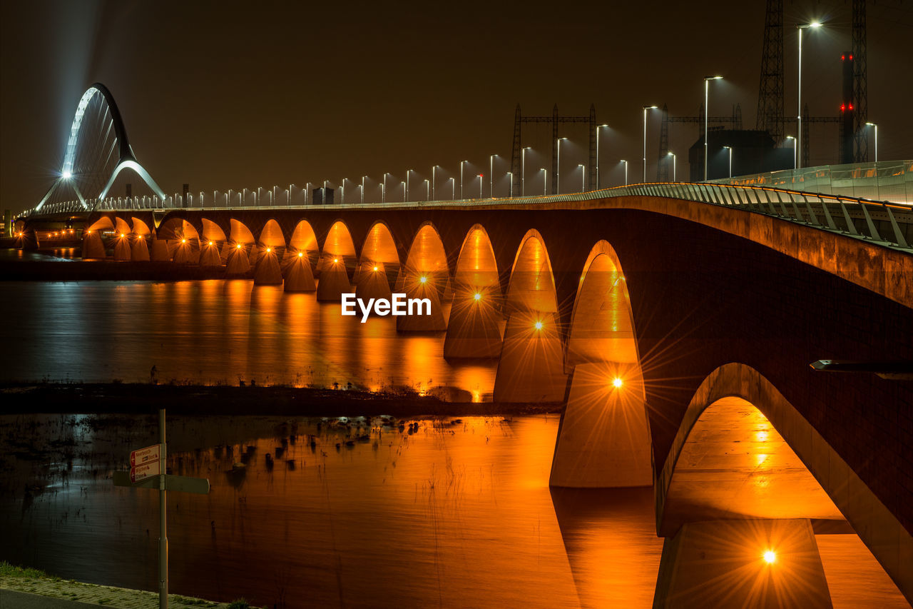 Illuminated suspension bridge at night