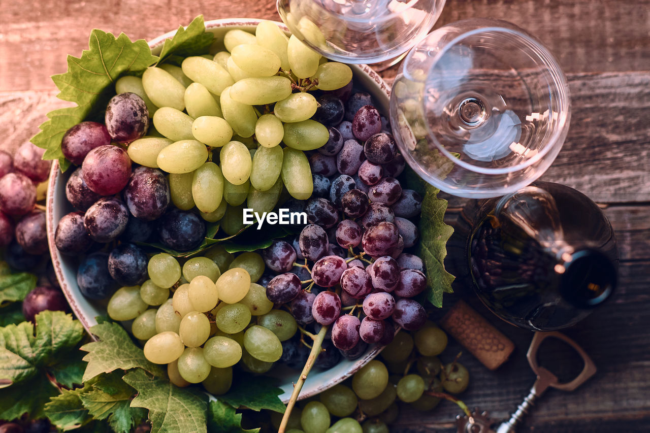 high angle view of grapes in container on table