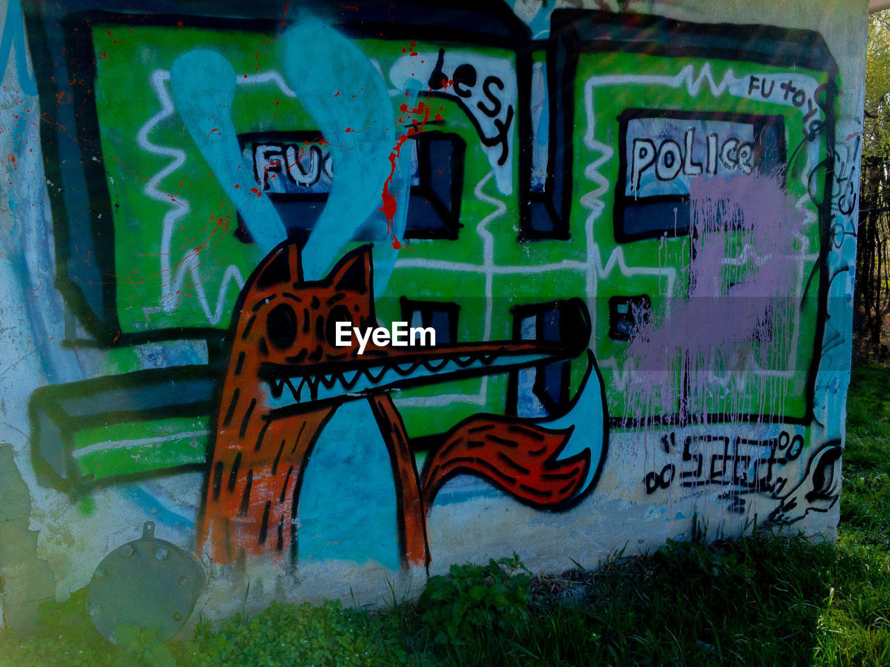 GRAFFITI TEXT ON ABANDONED WALL