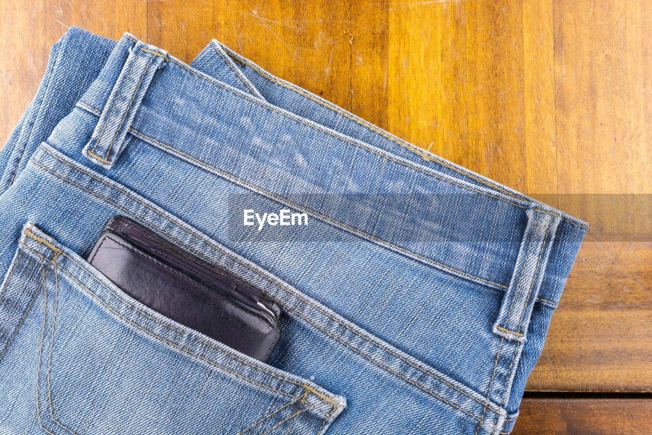 CLOSE-UP OF LEATHER AGAINST BLUE BACKGROUND