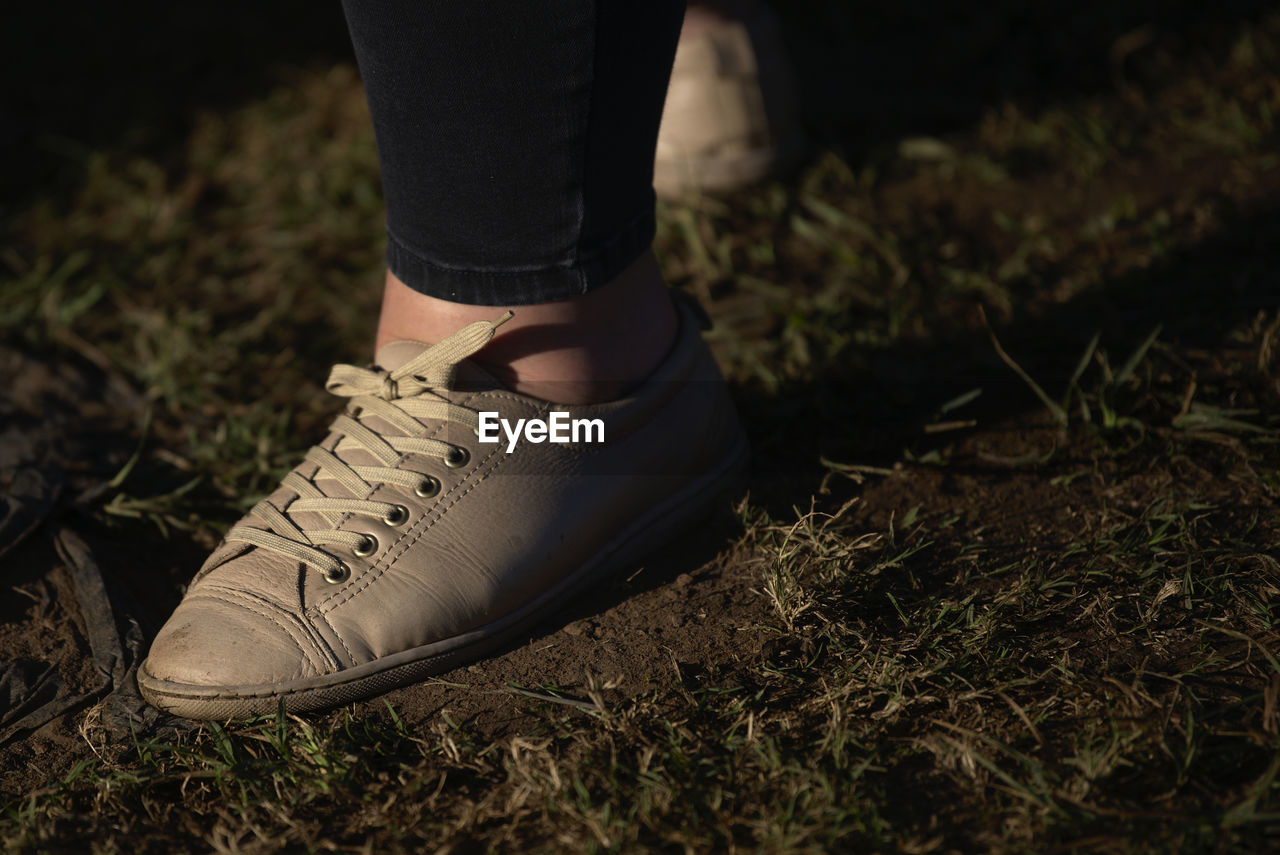 Low section of woman walking on land