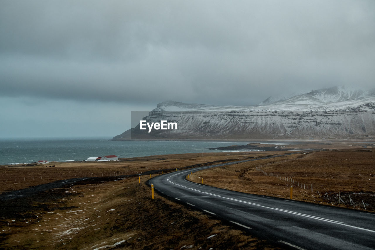 Road by land against sky during winter